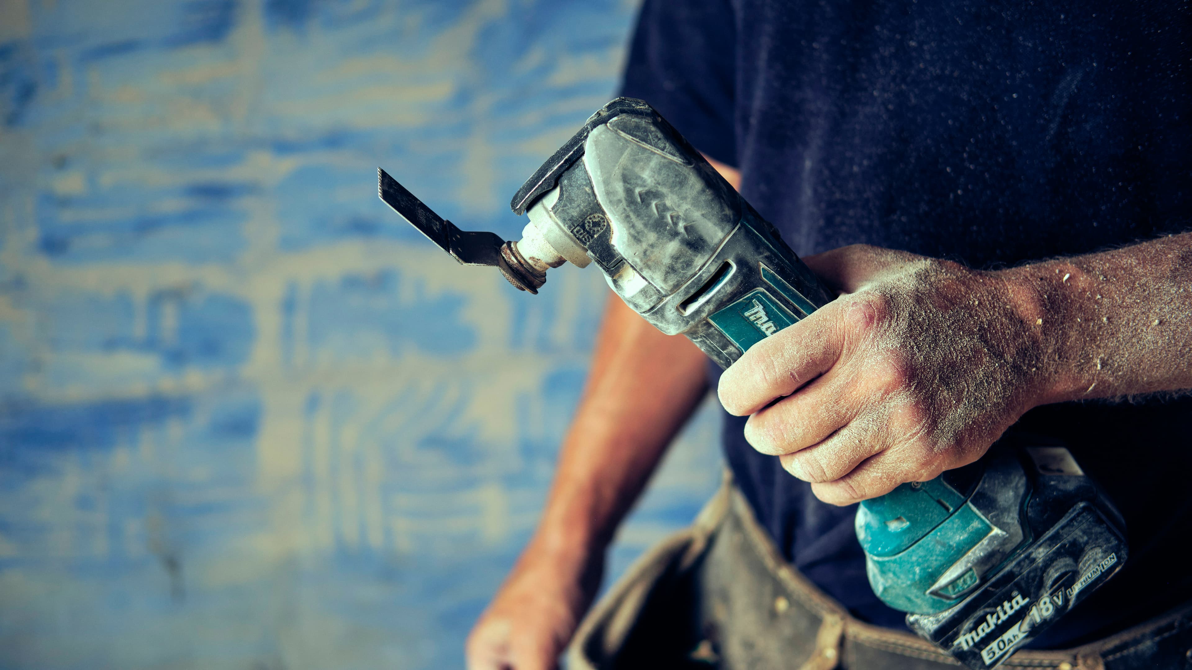 Builders Mate tradesman holding a power tool
